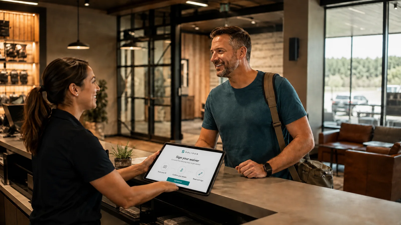 Illustrative scene of a range employee welcoming a customer at the counter